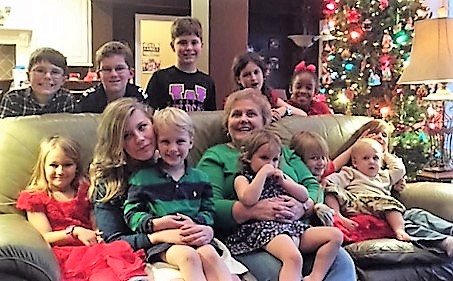 Connie enjoying Christmas with her 12 grandchildren BETWEEN travels