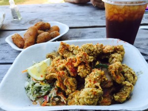 Oyster plate with slaw and potatoes at Saltbox