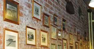 Vintage photos on the wall of Sandcastle depicting its storied history.