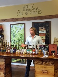 Ted Dennard, Founder, President, and Head Beekeeper at Savannah Bee Company, educating his customers about honey and bees.