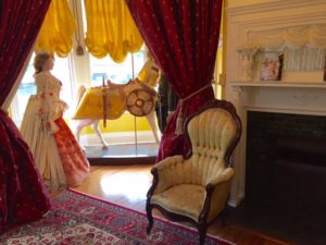 Fireplace and carved carousel horse in Camelot room.