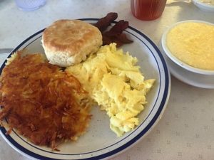 Scrambled eggs, bacon, fluffy biscuit, hashbrowns and cheese grits.