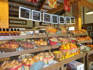 Colorful displays of fresh produce in the front section of the cafe.