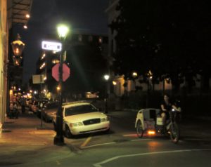 Popular mode of transportation favored over driving your car -- a bicycle taxi.  With all of the narrow, one-way streets and scarce parking spaces, this is a great way to go.