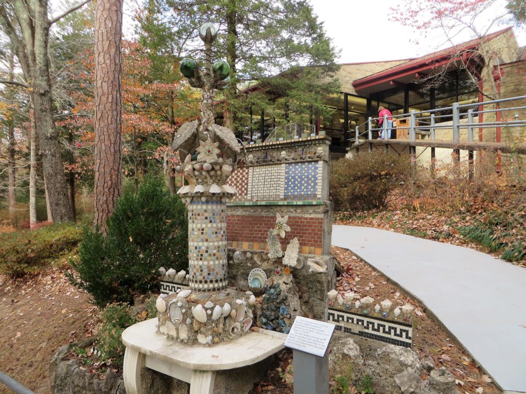 A miniature building at Ave Maria Grotto constructed of concrete and donated materials.