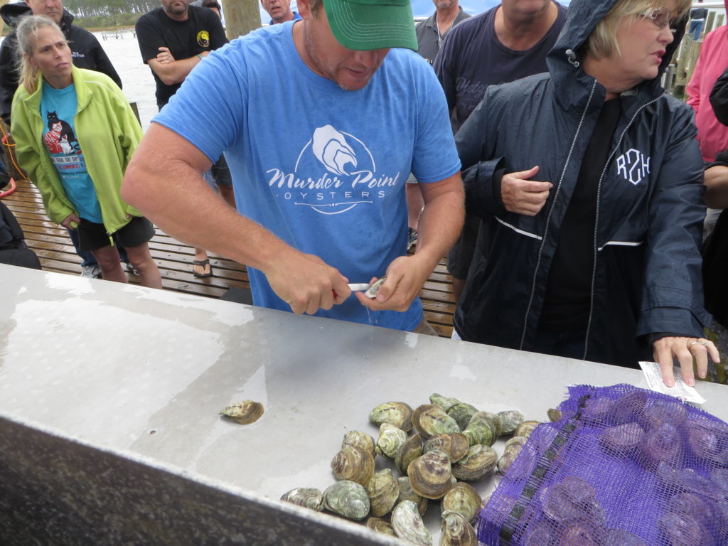 The final product of all that work -- shucking and sharing the plump, buttery oysters. 