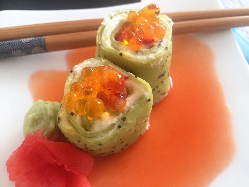 Orange crepes in the shape of sushi??